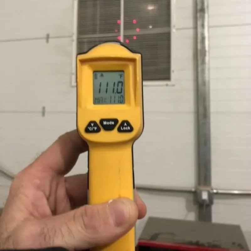 Temperature verification with Fluke gun during Green Valley HVAC service